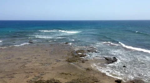 Sea surf on the rocks in the area  Punta Pesebre  on Fuerteventura Stock Footage 54654996