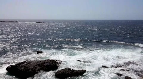 Sea surf on the rocks in the area  Punta Pesebre  on Fuerteventura Vidéo 54655229
