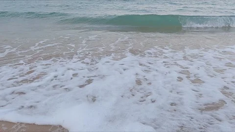 Sea surf on sandy beach, clear water, super slow motion Video stock 256321067