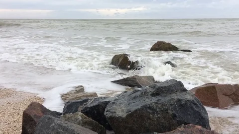 Sea surf on a sandy beach, rainy Video stock 83429096