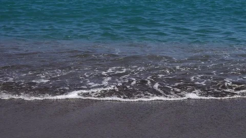 Sea surf on a sandy beach. Shoot from a low angle. Stock Footage 93155414