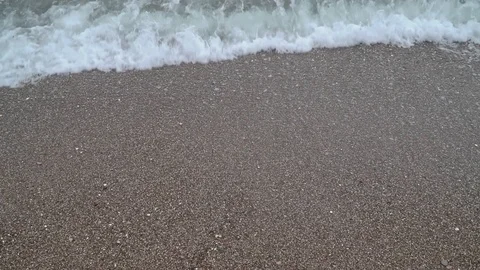 Sea surf on a sandy beach. slow motion Stock Footage 118979956