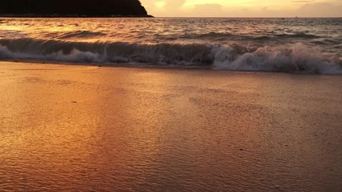 Sea surf on the sandy beach at sunset Stock Footage 120070970
