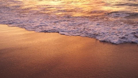 Sea surf on the sandy beach at sunset in thailand Stock Footage 120417214