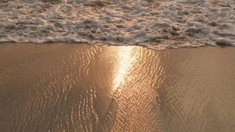 Sea surf on a sandy beach at sunset close-up Stock-Footage 284252964