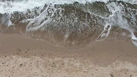 Sea surf on a sandy beach view from above Stock Footage 132195633