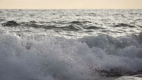 Sea Surf Wave at Sunset Close-Up. Slow Motion Stock Footage 106460299