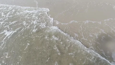 Sea surf. Waves lapping on the sand on the seashore.   Slow motion. Stock Footage 263119488