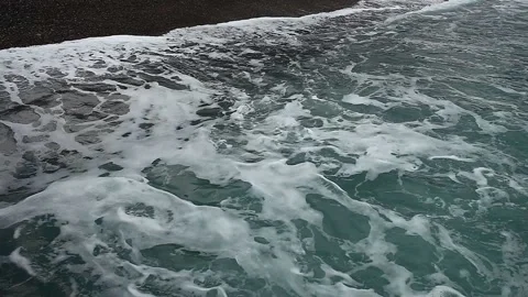 Sea surf, waves on the stone coast on a cloudy day Stock-Footage 149114429