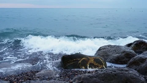 Sea surf waves on the stone seashore Stock Footage 84745932