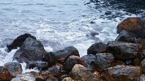 Sea surf waves on the stone seashore Stock Footage 84745984