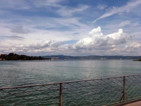The sea surface and distant small mountains can be seen through the iron Stock Photos