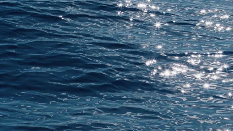 Sea surface with blinking stars and flares as seen from the moving sailing boat Stock Footage 339273248