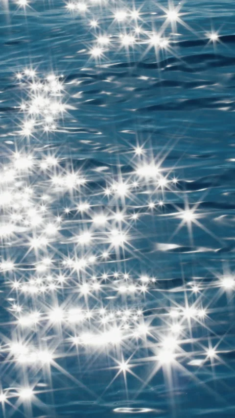 Sea surface with blinking stars and flares as seen from the moving sailing boat Stock Footage 339983188
