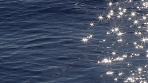 Sea surface with blinking stars and flares as seen from the moving sailing boat Stock Footage 340201195