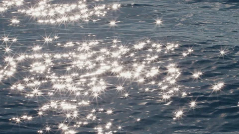 Sea surface with blinking stars and flares as seen from the moving sailing boat Stock Footage 341659391