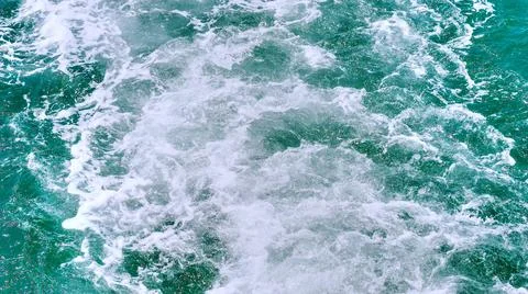 The sea surface is broken into a white bubble. Stock Photos