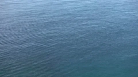Sea surface with fine ripples, subtle movement texture background Video stock 332553680