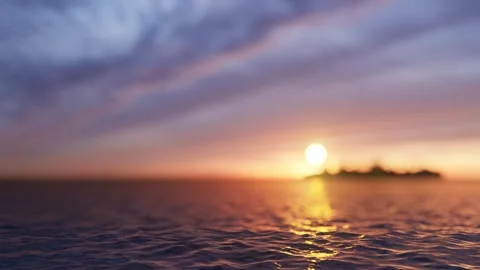 Sea surface in the foreground and sunset with an island in defocus Stock-Footage 263795285