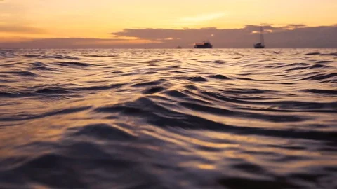 Sea surface low angle view at sunset, ripple on calm water Stock Footage 109180112