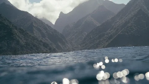 Sea surface overlooking beautiful mountain ranges Stock Footage 108644487