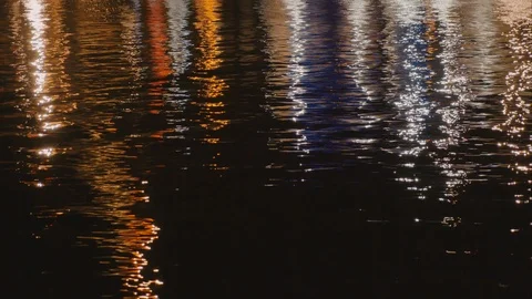 Sea surface. Reflection of bright spotlights on the water surface. Float lights Stock Footage 91583374