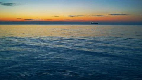 Sea surface. Reflection of bright spotlights on the water surface. Quiet ripples Stock Footage 91613435