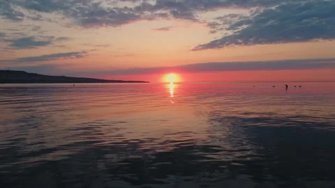 Sea surface with small waves against backdrop of sunset of sun evening Stock Footage 136161739
