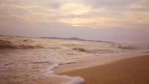 Sea surface with small waves against the backdrop of sunrise of sun slow motion Stock Photos