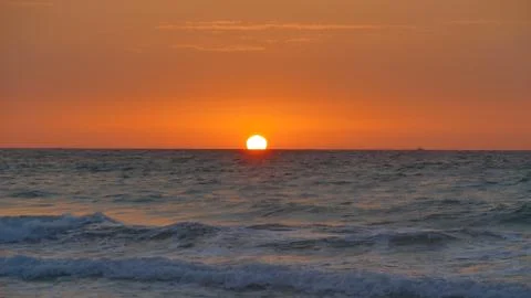 Sea surface at sunrise Stock Photos