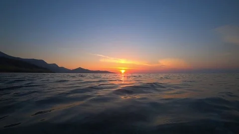 Sea surface at sunset. Slow motion Stock Footage