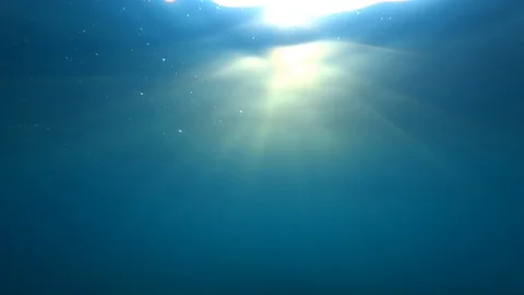 Sea surface underwater with sun ray and sun beam Stock Footage 127138906