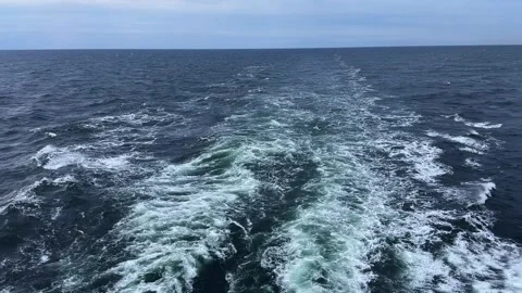 Sea surface with wake from ship, view at overcast morning Stock Footage 345663810