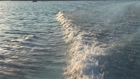 Sea surface of the water, view from a moving boat. The boat sails on the Stock Footage 97924520