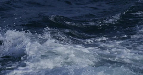 The sea surface of the water. waves from the ship. 120pfs shot on red komodo Stock Footage 220811149