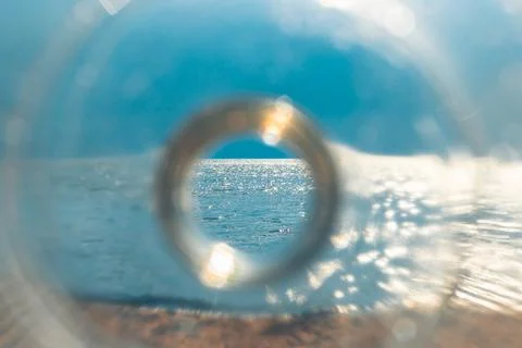Sea through a plastic bottle. 스톡 사진