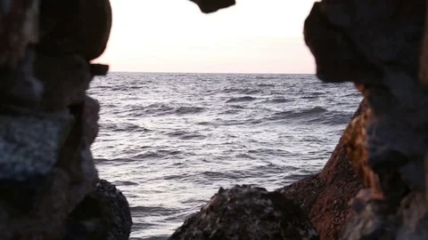 Sea through a window in a cave Stock Footage 72659547