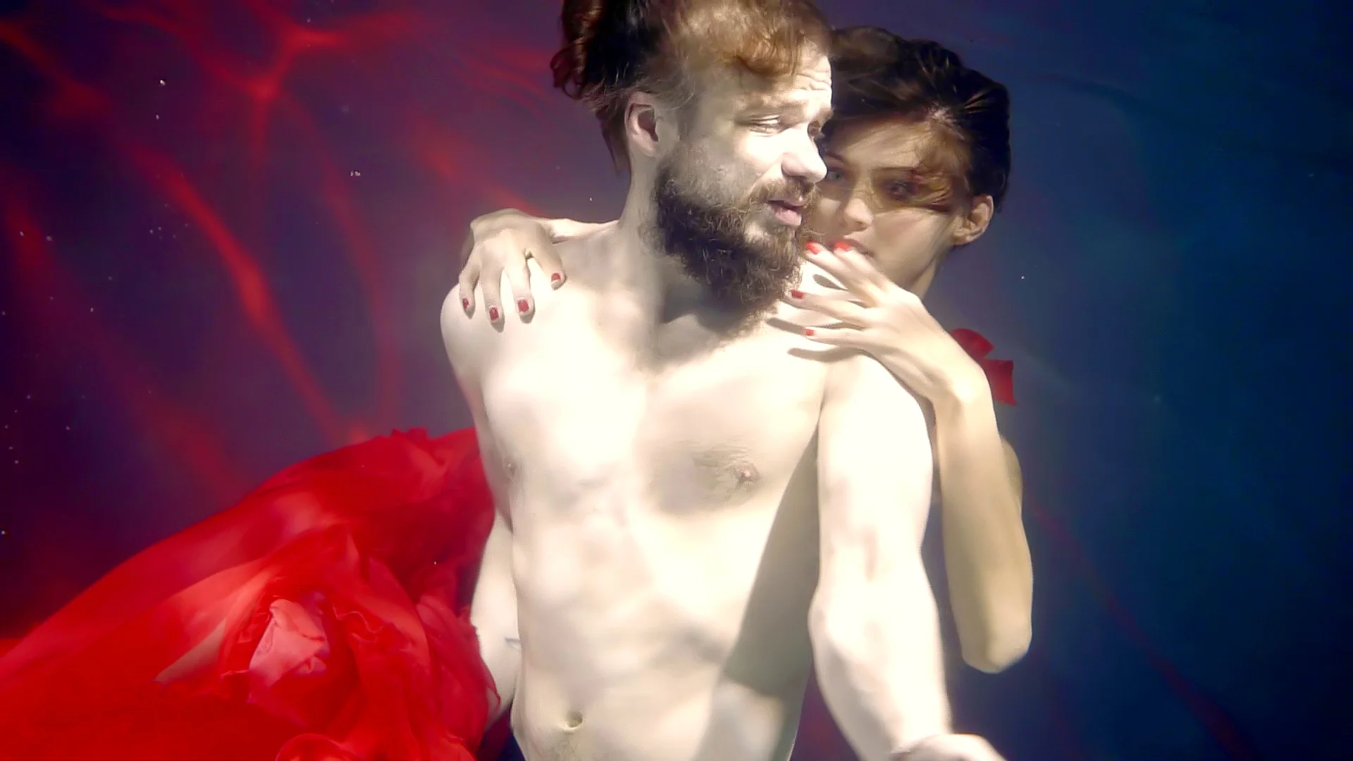 sea underwater nymph is hugging naked sinking man and pushing him to depth  of