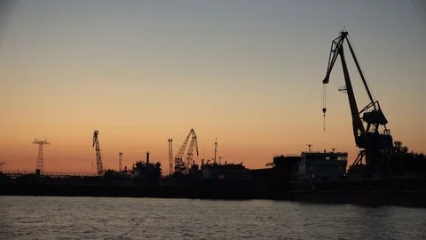 Sea unloading port in the rays of the sunset Stock Footage 85372051