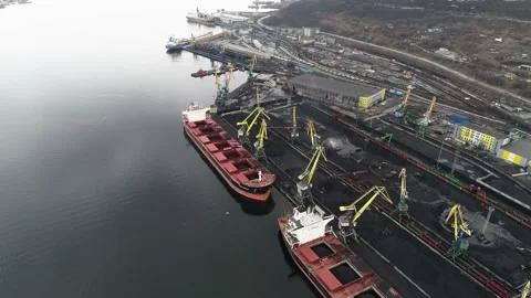 Sea vessels with open cargo compartments for the transportation of coal to Stock Footage 203919963
