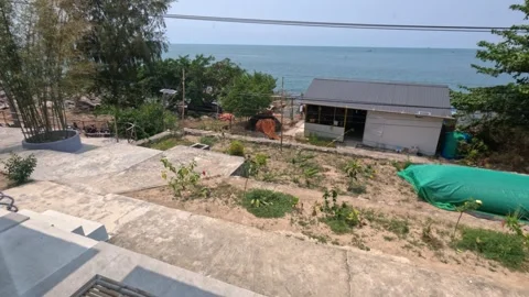 Sea view from a beach house window in a small island village, morning 스톡 동영상 246911144