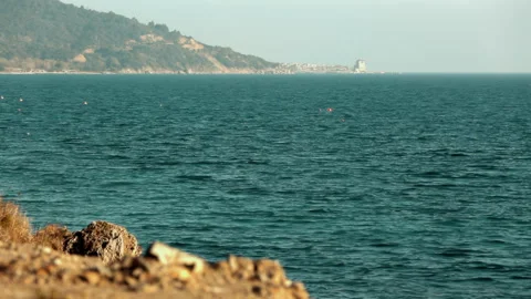 Sea view from behind a small stone. Stock Footage 252749131