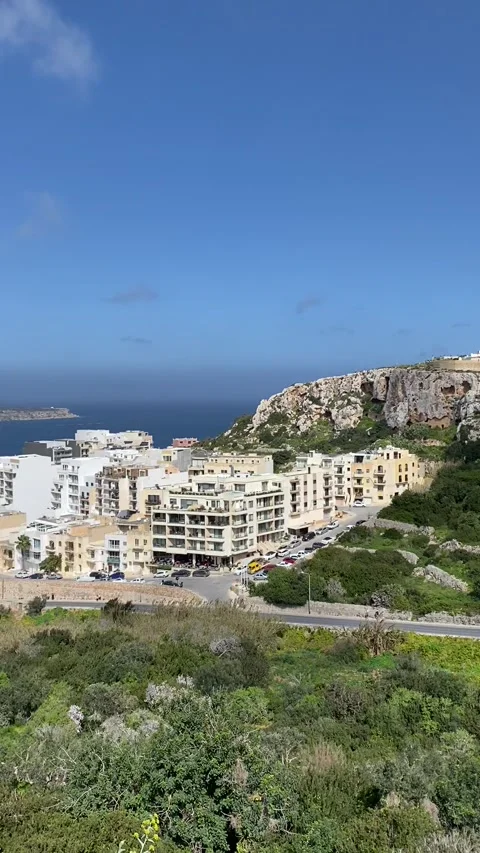 Sea View from Cafe Bar over Mellieha town green fields and Mediterranean Sea Stock Footage 309247314