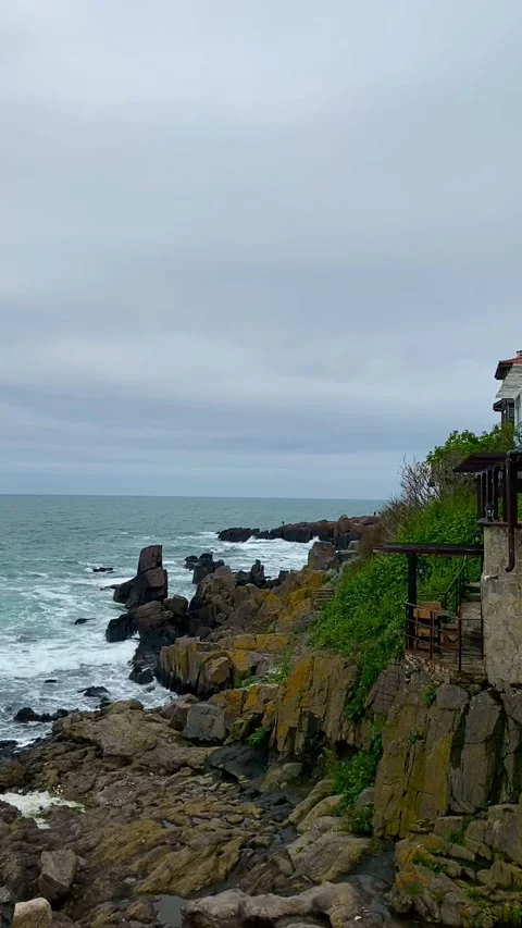 Sea view with cliffs and large stones in Sozopol, Bulgaria in cloudy weather. Video stock 342795023