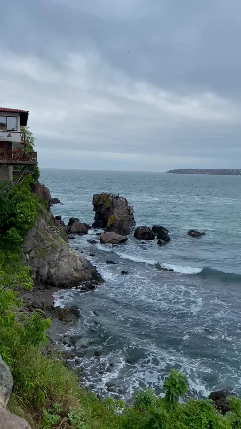 Sea view with cliffs and large stones in Sozopol, Bulgaria in cloudy weather. Video stock 342811605
