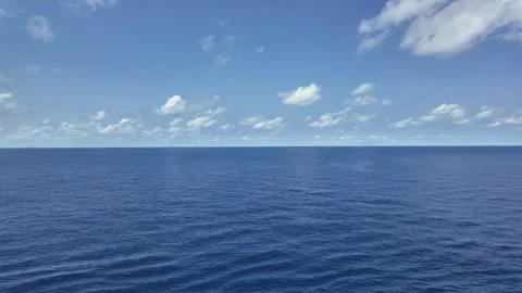Sea View on Cloudy Day Blue Sky Storm Clouds and Lonely Boat Horizon Time Lapse 動画素材 256067231