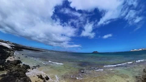 Sea view of Corralejo Beach with waves and rockery Stock Footage 277335627
