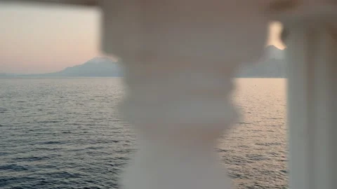Sea view during sunset with mountains in the background. Historical city and Stock Footage 200480229
