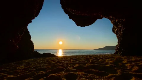 Sea View From The Inside Of A Dark Cave on the horizon of the sea evening sunset Stock Footage 171991640