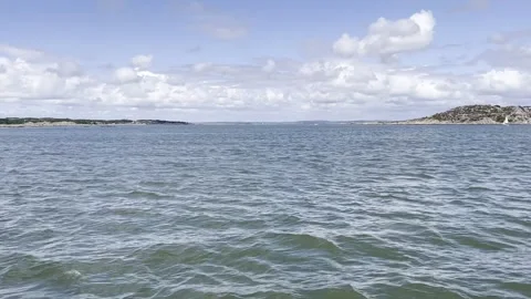 Sea view from a moving ship between islands Stock Footage 247516193